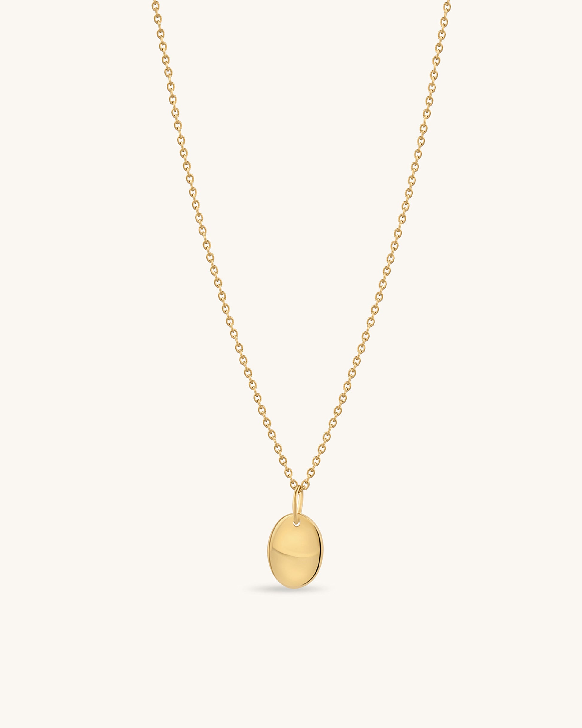 Gold disc pendant necklace