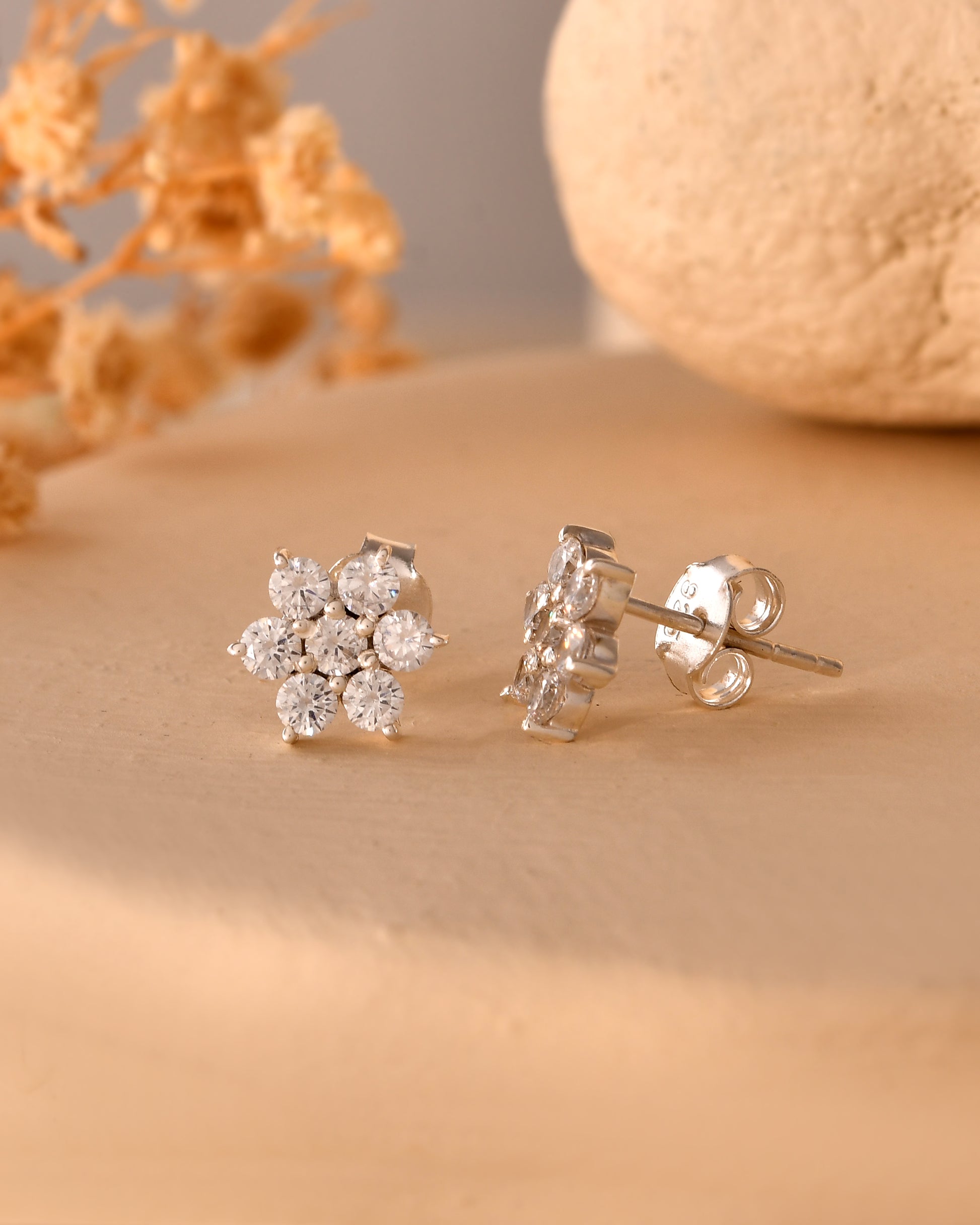 Floral white stone stud earrings