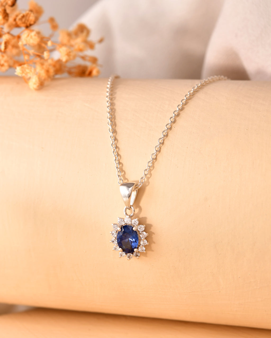 Blue oval halo pendant necklace