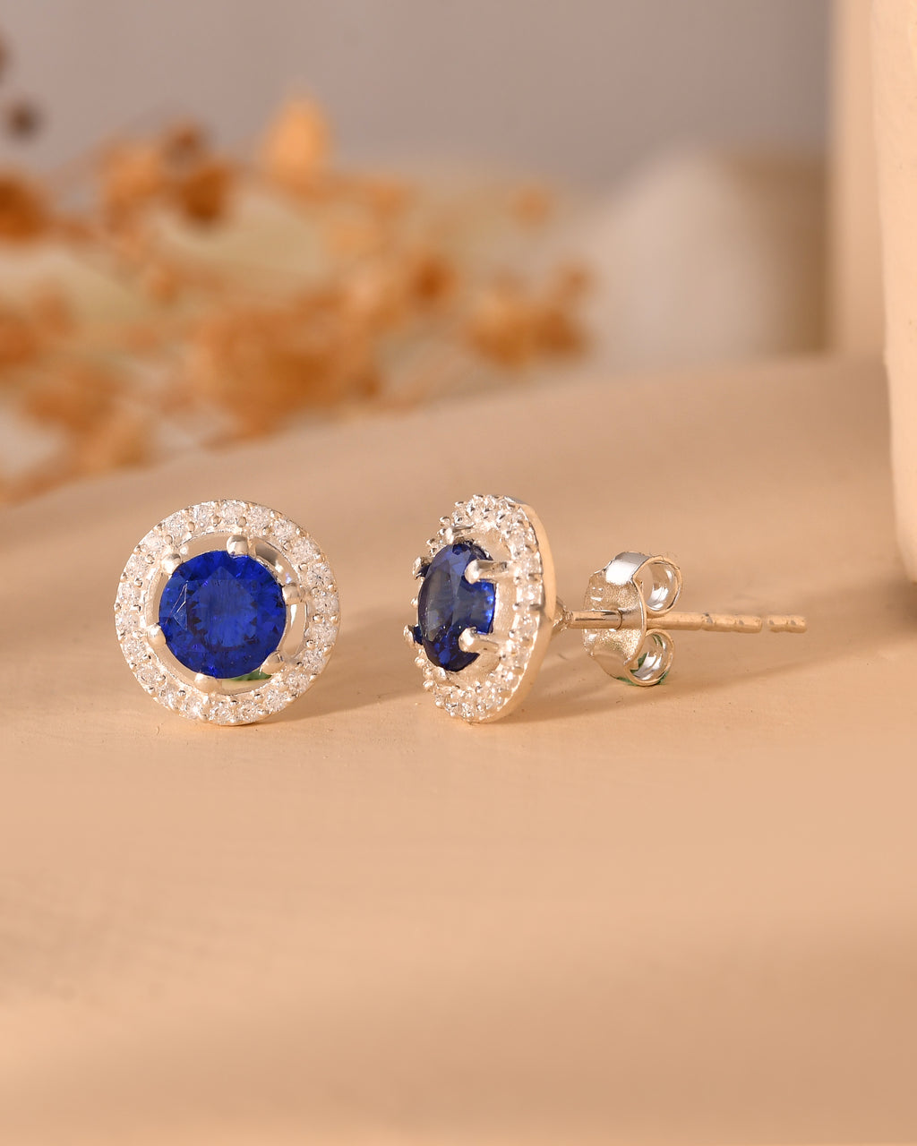 Blue stone halo stud earrings