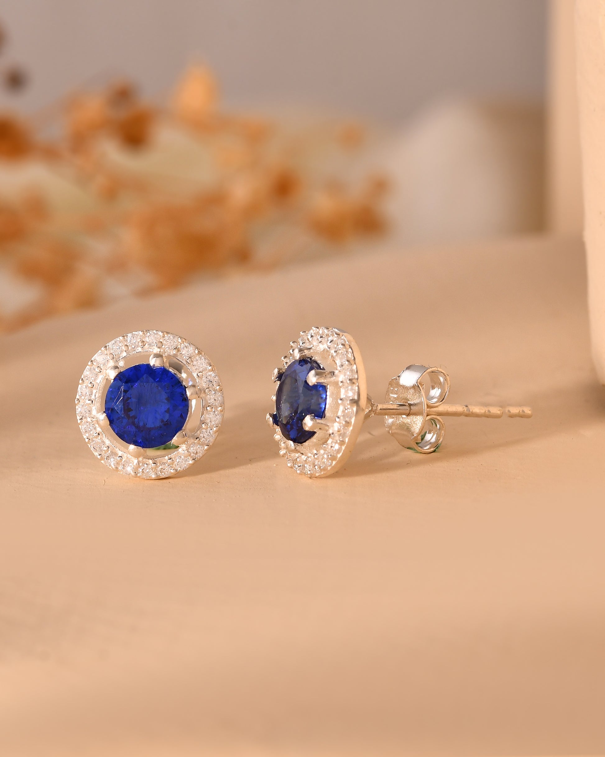 Blue stone halo stud earrings